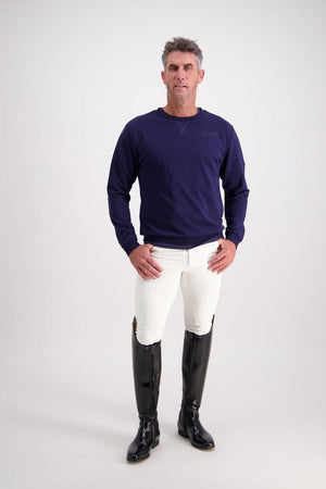 Man wearing a navy Gallant Equestrian Mens Sweatshirt with bone jodhpurs and black riding boots.