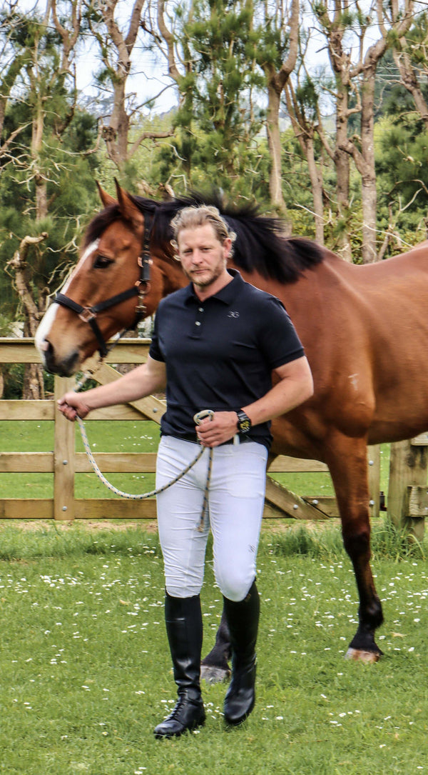 Man with horse wearing Gallant Equestrian Black Polo Shirt 