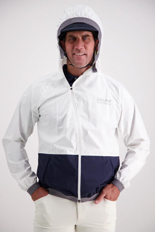 Man wearing Gallant Equestrian Mens Equestrian Rain Jacket with asymmetrical zip and helmet-friendly hood.