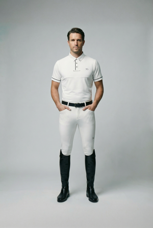Male model wearing white mens competition breeches with knee silicone grip and black riding boots