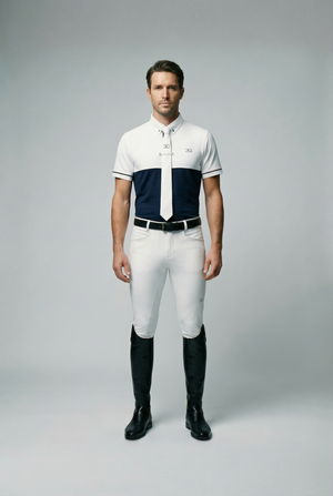 Men's show shirt in white and navy, slim fit, breathable fabric, with button-down collar and tie holder, worn by male equestrian model.
