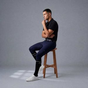 Black and navy men's riding socks with reinforced heel and toe, designed for comfort and support under boots.