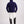 Back view of person wearing Gallant Equestrian Mens Equestrian Hoodie in navy, paired with bone jodhpurs and black riding boots.