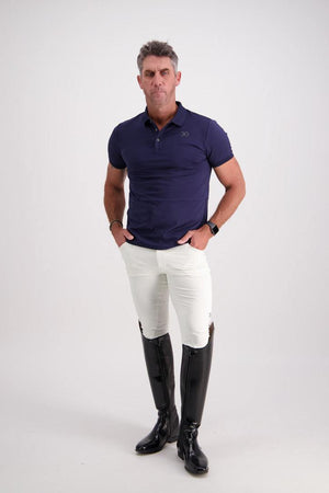 Man wearing navy Gallant Equestrian Mens Equestrian Polo Shirt with bone jodhpur and black riding boots, showcasing a tailored slim fit.