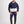 Man wearing Gallant Equestrian Mens Equestrian Rain Jacket in navy and bone, paired with jodhpurs and riding boots.