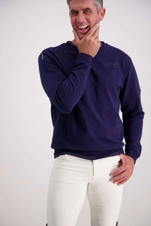 Man wearing Gallant Equestrian Mens Sweatshirt in navy, paired with bone jodhpurs.