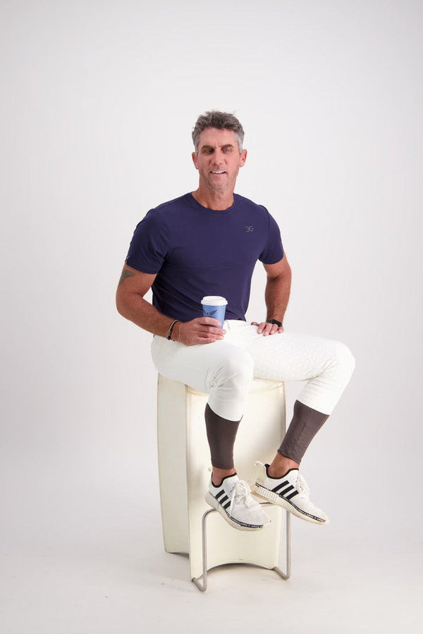 Gallant Equestrian Mens Short Sleeve Tee in navy on seated model, showcasing tailored fit and lightweight design.