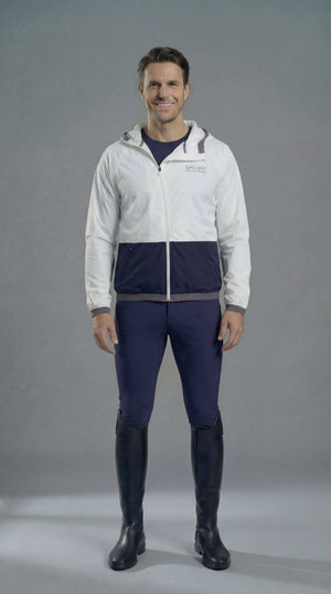Men's equestrian rain jacket in bone color, lightweight, slim-fit with asymmetrical zip and elasticated hood for riding helmet.
