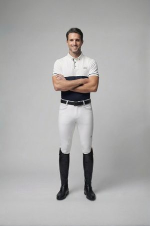 male equestrian wearing white mens competition breeches with full seat grip and black riding boots