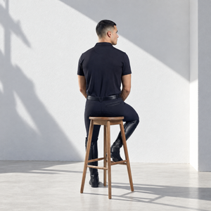 Mens Polo Shirt in black stretch fabric, featuring short sleeves, a classic collar and a sleek tailored fit.