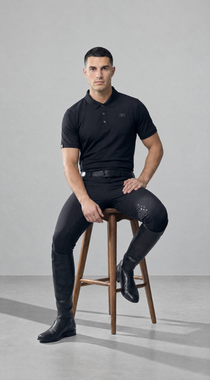 Mens Polo Shirt in black stretch fabric, featuring a classic collar, button placket and subtle chest logo.