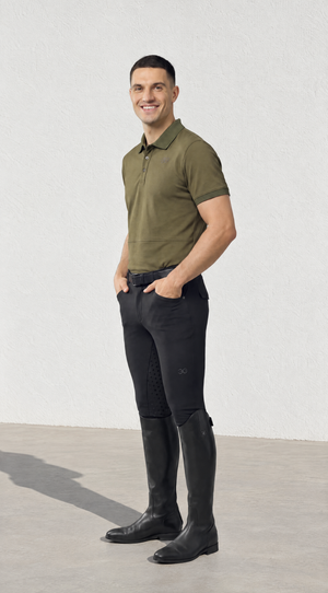 Mens Polo Shirt in olive green with short sleeves, a dark collar and subtle chest emblem, styled in a slim fit.