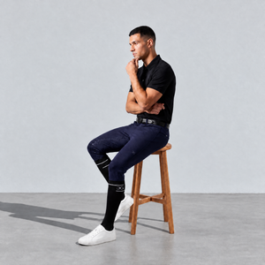 Mens Riding Socks in black, worn knee-high with a slim fit and subtle white logo near the top.