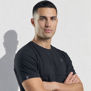 Mens Short Sleeve Tee in black, with a crew neck, subtle chest logo, and a small sleeve tag.
