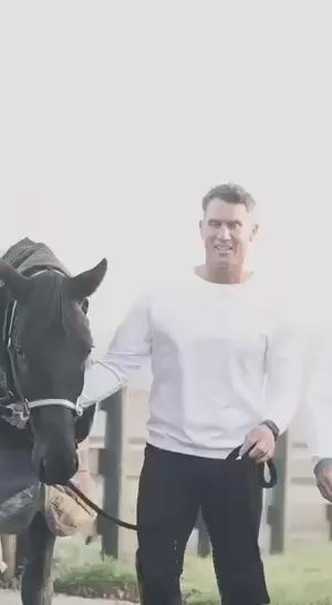 Male riders wearing essential riding clotheds with horses 